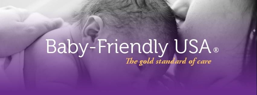 a mom kissing a baby | baby-friendly USA